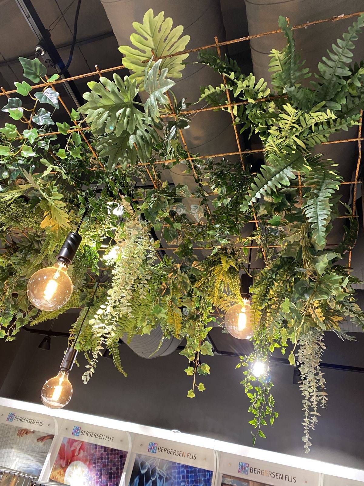 Artificial greenery ceiling installation for a commercial space