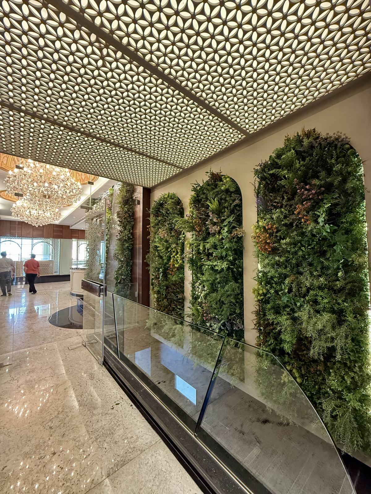 Artificial green wall in a luxury hotel lobby by Neon Jungle Studios