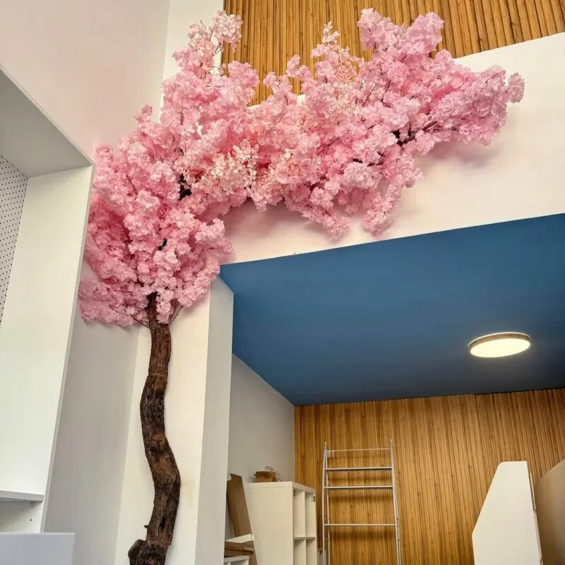 cherry blossom spreading onto the ceiling — room corner, Lebanon — installation by Neon Jungle Studios