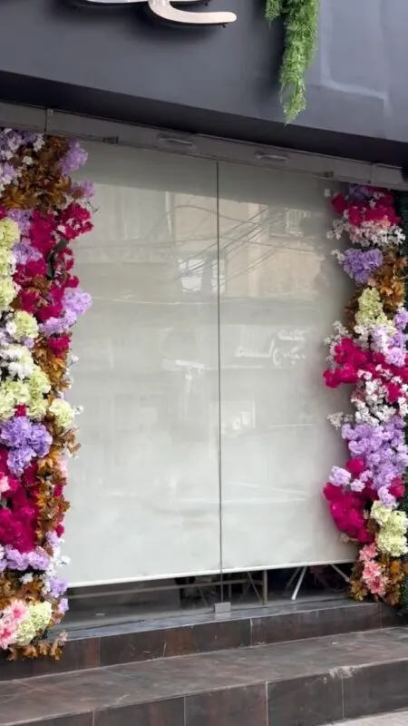 columns of colourful flowers — shop window, Lebanon — installation by Neon Jungle Studios