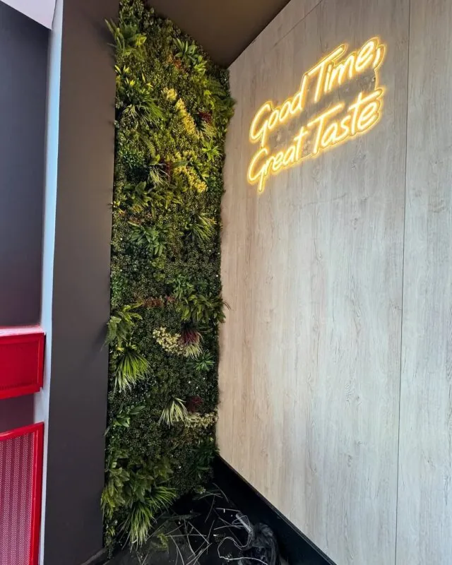 gold neon phrase on a wood panel — restaurant, Lebanon — installation by Neon Jungle Studios