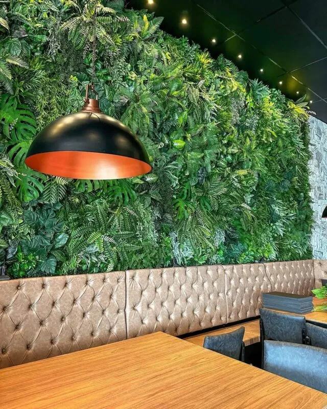 green wall above booth seating — restaurant, Lebanon — installation by Neon Jungle Studios