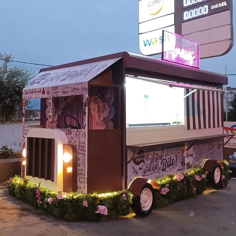 greenery and flowers along the base — food truck, Lebanon — installation by Neon Jungle Studios