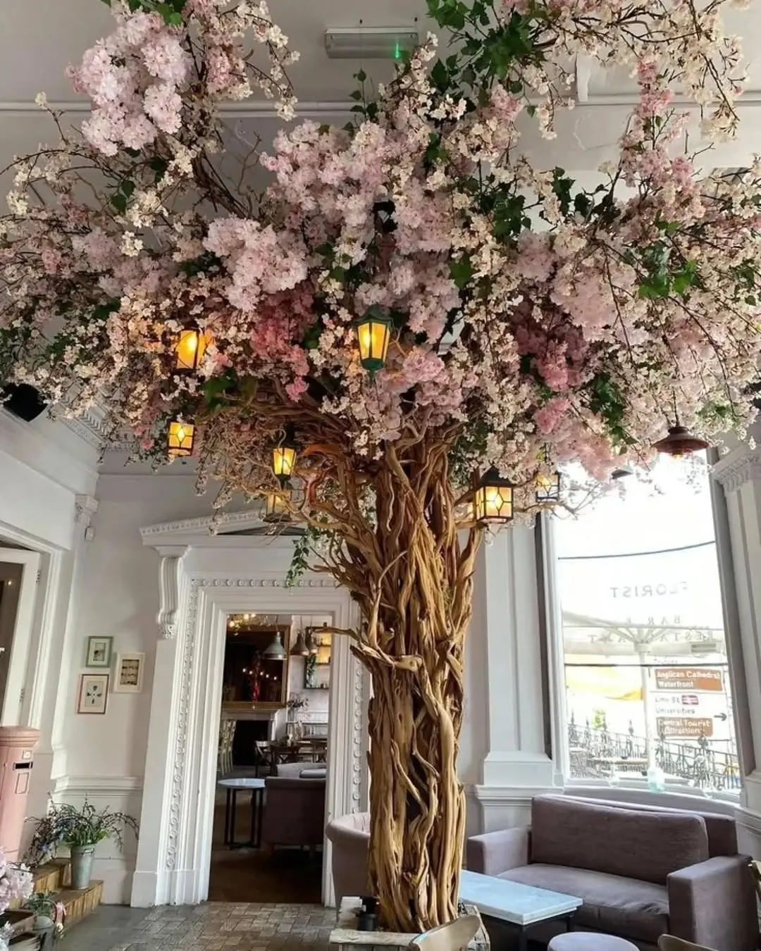 huge blossom tree with hanging lanterns — classic café, Lebanon — installation by Neon Jungle Studios