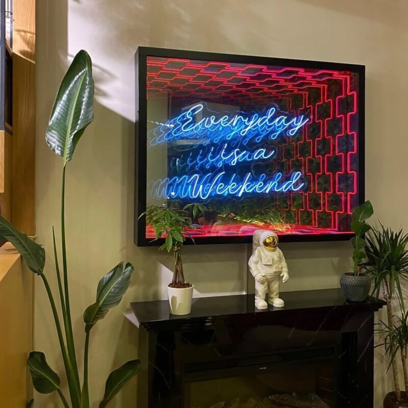 infinity mirror with a blue neon phrase — home fireplace wall, Lebanon — installation by Neon Jungle Studios