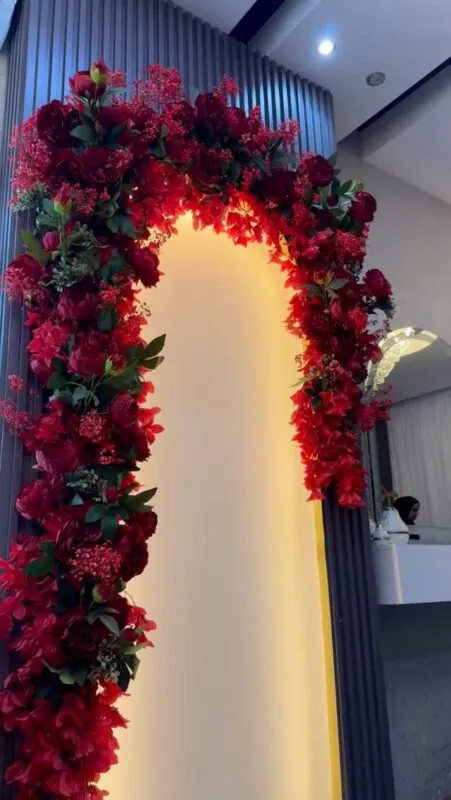 lit red floral arch — beauty clinic entrance, Lebanon — installation by Neon Jungle Studios