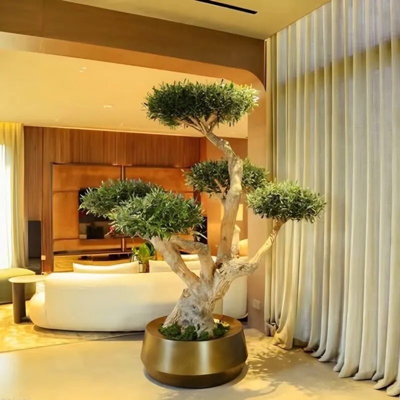 olive bonsai in a gold planter — living room, Lebanon — installation by Neon Jungle Studios