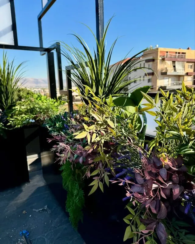 tall planters of palms and grasses — rooftop restaurant, Lebanon — installation by Neon Jungle Studios