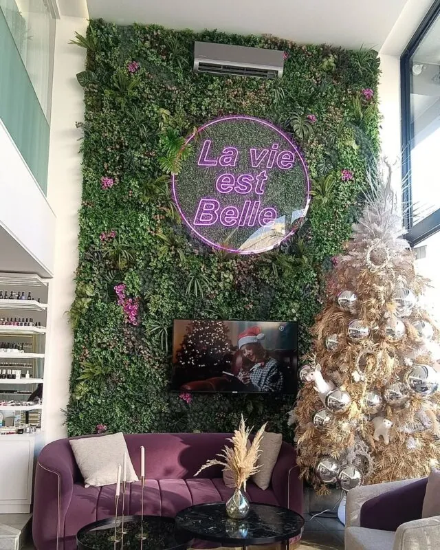 vertical garden with a pink neon phrase — beauty clinic, Lebanon — installation by Neon Jungle Studios